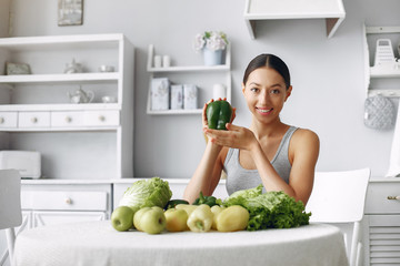 Healthy eating. Dieting and people concept. Brunette with a vegetable.