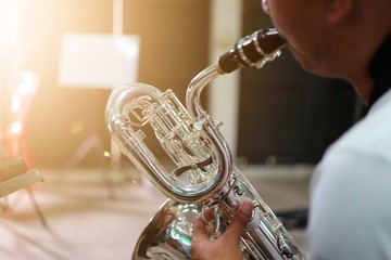 young man playing saxophone