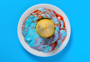 top view melted marshmallow and raspberry flavor ice cream cone on a dish