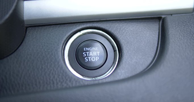 Pushing power ignition button to start keyless ignition hybrid car engine