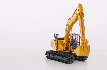 Yellow excavator   model  on  a white background,With bucket lift up