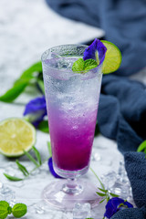 Healthy drink, organic blue pea flower tea with lemon and lime.