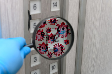 looking at the button of a lift via a magnifier and seeing lots of coronavirus