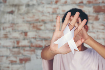 Young male boy making hand stop sign International day of non violence.