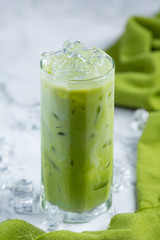 Matcha ice green tea on marble floor It is a delicious and nutritious relaxation drink.