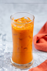 Iced milk tea on marble pattern floor It is a delicious and nutritious relaxation drink.