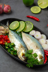 Hot and Spicy Mackerel Decorated with Thai food ingredients, World Food Day.