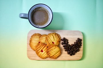 cup of coffee with cookies