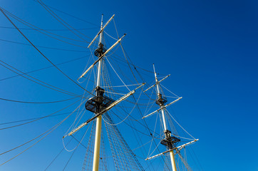 Masts of a sailing ship in the daytime.