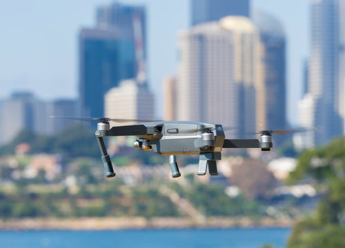 Sydney, Australia - May 11, 2017: A DJI Mavic Pro drone flying near city centre. Many countries have implemented laws to regulate the use of drones to ensure public safety.