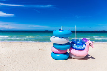 The rubber rings stacked in layers on the beach with blue sky background on Koh Larn, Pattaya, Thailand.