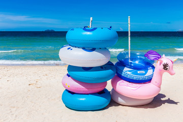 The rubber rings stacked in layers on the beach with blue sky background on Koh Larn, Pattaya, Thailand.