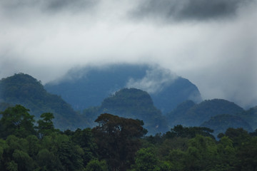 Raining cloud over the mountain and forest near border Thailand and Laos