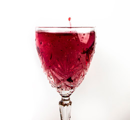 red wine pouring into glass