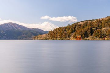 Mount Fuji appears behind the clouds in Lake Ashi, Hakone Japan
