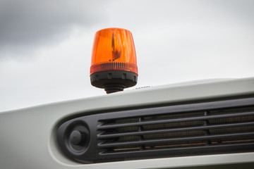 Orange signal lamp on forklift, excavator or other industrial machine. Safety during work