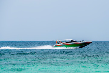 The speedboat runs at sea speed.