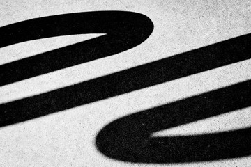 Bike Rack Shadow on Street