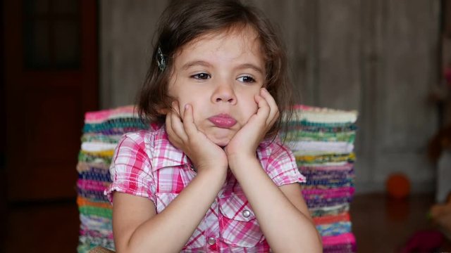 Upset Little kid girl starts to cry but then smiling