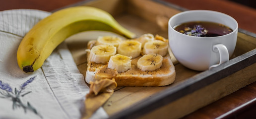 breakfast served on a wooden tray