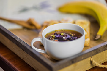 cup of fragrant tea with breakfast on a background