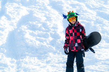 Fototapeta na wymiar Portrait of Boy with Snowboard