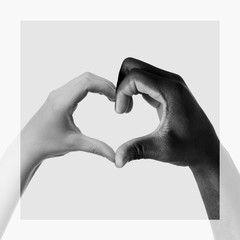 Hand of African-American man showing heart shape on white background