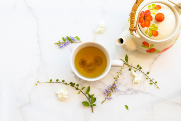 herbal healthy drinks hot chrysanthemum tea local flora of asia with teapot, flower jasmine ,purple in summer season arrangement flat lay style on background white 