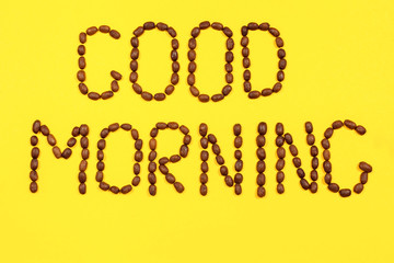 Close up view of word Good morning from roasted coffee beans