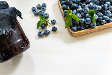 Blueberries and blueberry jam with copy space