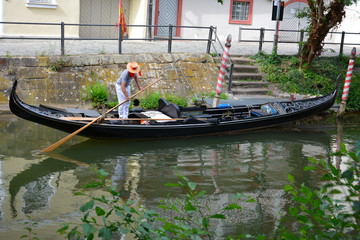 gondola and gondolier in a canal ,Bamberg, Germany - obrazy, fototapety, plakaty