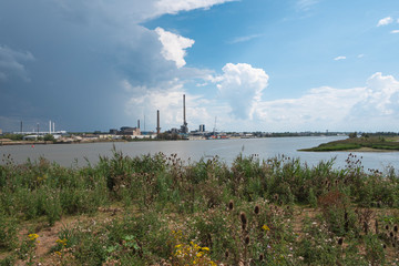 Landscape photo of the industrial sites on the bank of the river Scheldt in Hoboken, Belgium
