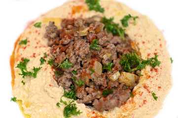 Warm hummus served with ground beef meat