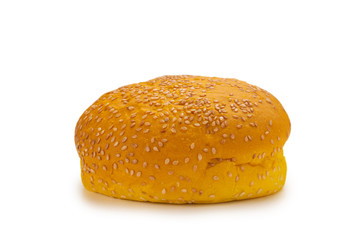 Yellow burger bread isolated on white.