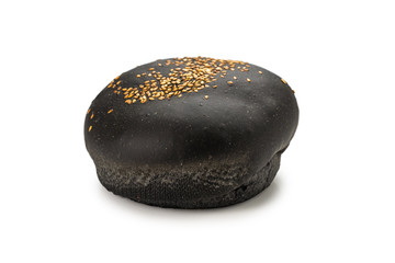 Black burger bread isolated on white.