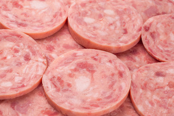 Boiled sausage isolated on white background. Slices.
