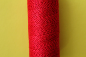 Colored thread for embroidery.Sewing thread. Threads for sewing on yellow background