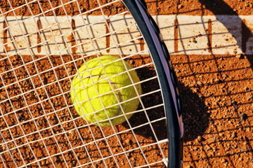 tennis ball on a tennis court .