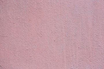 Texture of an old painted wall. Rough surface of the plastered and colored wall. Perfect for background and design. Closeup.