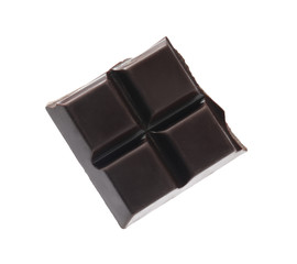Piece of delicious dark chocolate isolated on white