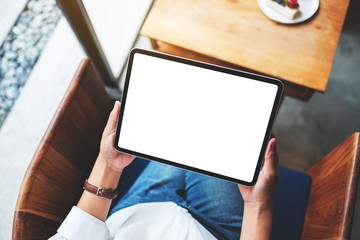 Top view mockup image of a business woman holding digital tablet with blank white desktop screen