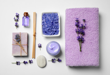 Plakat Cosmetic products and lavender flowers on white background, flat lay