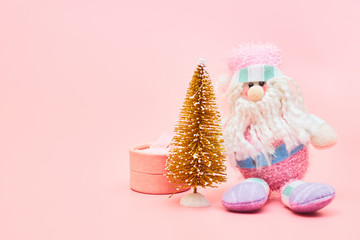 christmas decoration on pastel pink background, copy space