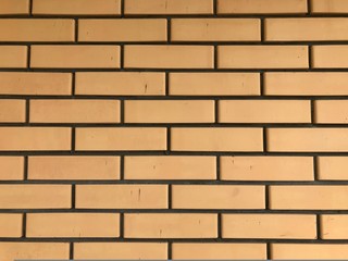 Smooth brick wall close up. Background or texture