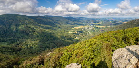 Panorama of summer landscape from high stony viewpoint
