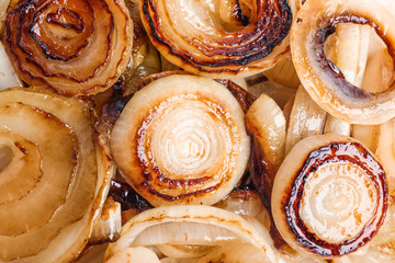 Fototapeta premium Tasty fried onion as background, top view