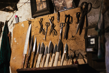 Old rusty carpenter tool kit on a wooden table