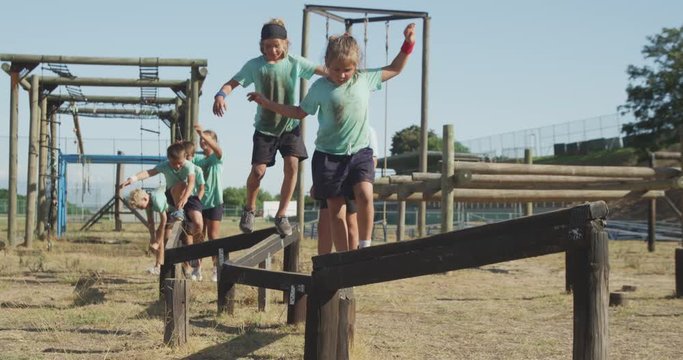 Group of Caucasian children training at boot camp 
