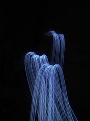 light painting Photography, long exposure, ripple curve and circle against black background