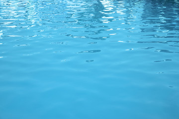 Clear water in swimming pool as background, closeup